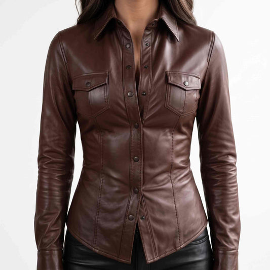 Front close up view of a woman wearing a tailored chocolate brown lambskin leather shirt with snap buttons and flap chest pockets.