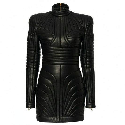 A black lambs leather bodycon mini dress with a mock neck, gold zipper at the collar, and sculptural ribbed panels, shown on a white background with a watermark.