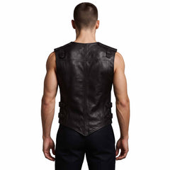 Back view of man wearing tailored black leather gothic vest displaying horizontal shoulder yoke, clean spine seams, and pointed rear hem