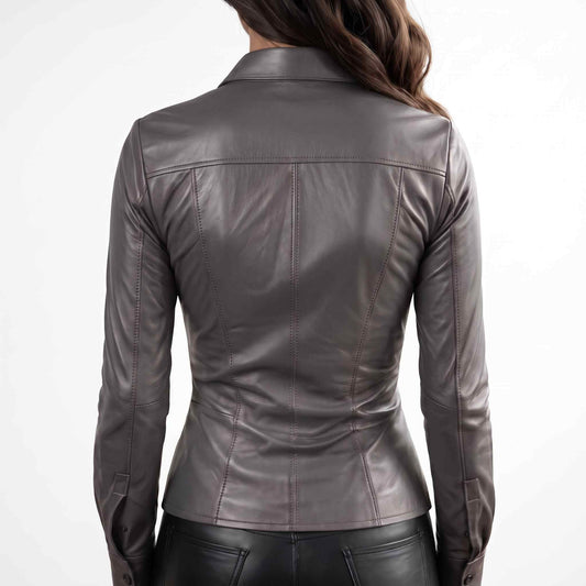 Back close up view displaying the structured shoulder yoke and contoured panel seams on a women's gray fitted leather blouse.