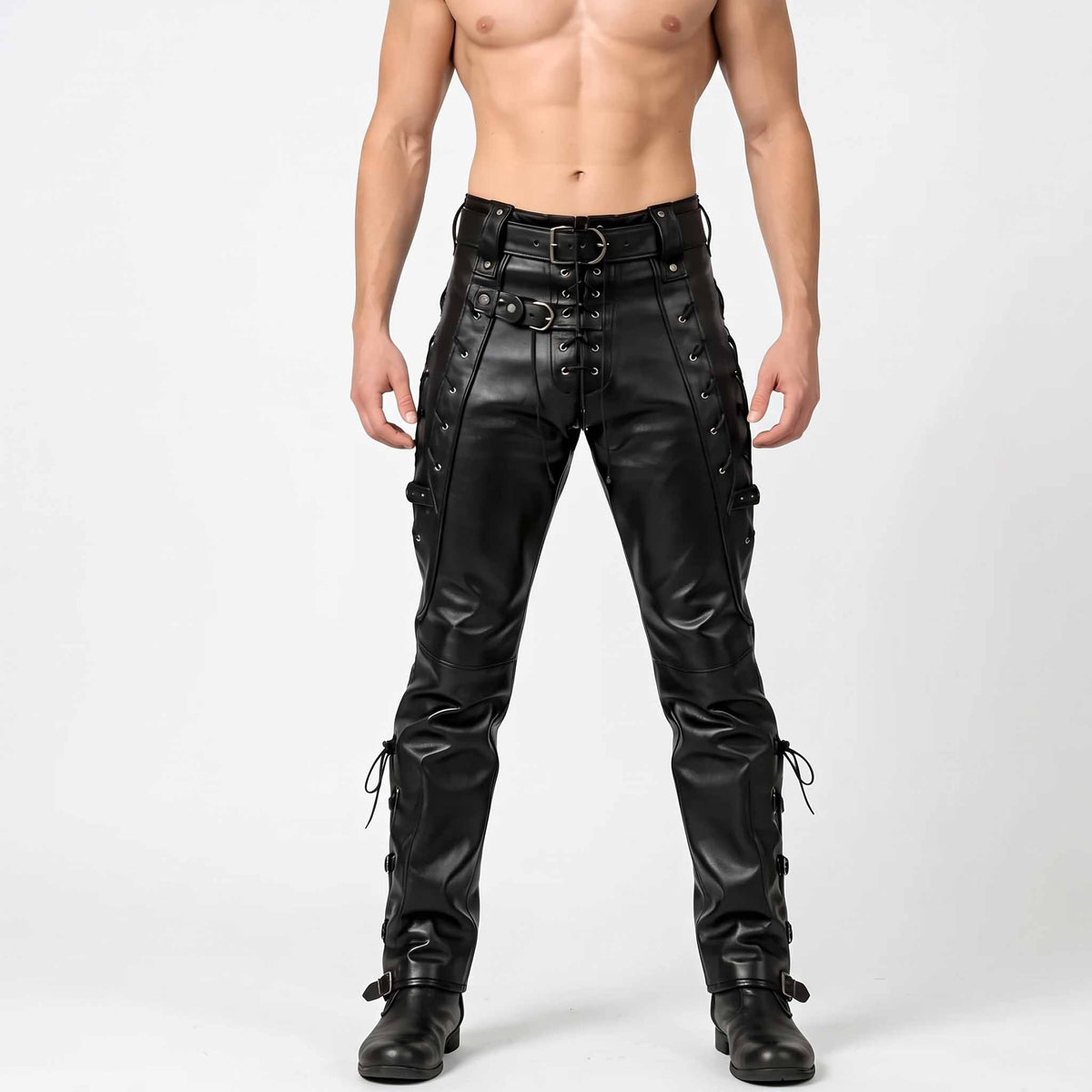 Front studio view of man wearing handmade black leather lace up pants with waist roller belt and side thigh cords