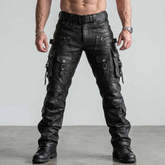 Full length front view of muscular man wearing handmade black leather cargo pants with tactical buckle straps and combat boots