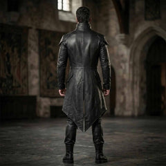 Rear full body view of black leather vampire tailcoat showing contoured vertical seam panels and dramatic pointed split tails