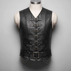 Front view of handmade men's black leather gothic steampunk vest featuring six front buckles, wide waist belt, and hanging metal chains on a tailor mannequin.
