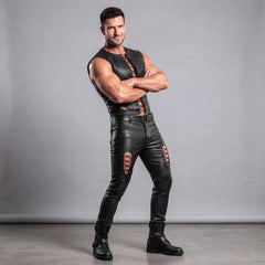 Athletic model wearing custom-tailored black leather gothic punk two-piece outfit with metal eyelets