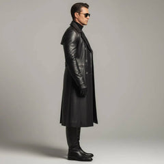 Rear full body view of mens black cowhide leather duster coat showing upper storm flap waist belt and center split walking vent