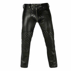 Front view of men's black real leather trousers displaying diamond-quilted knee panels and quilted front fly paneling.