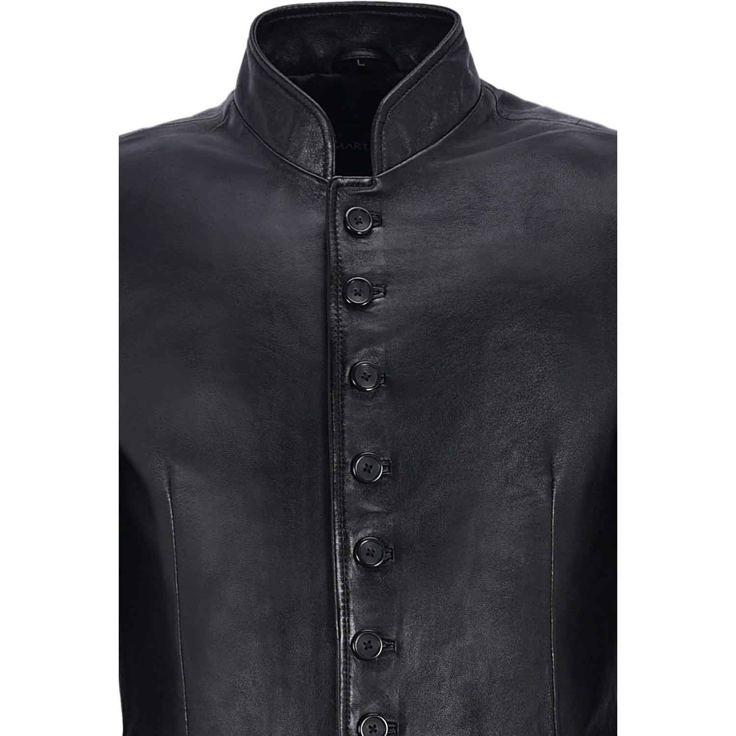 Close-up view of the double-stitched panel seams and flared hem section on a men's black leather gothic duster.