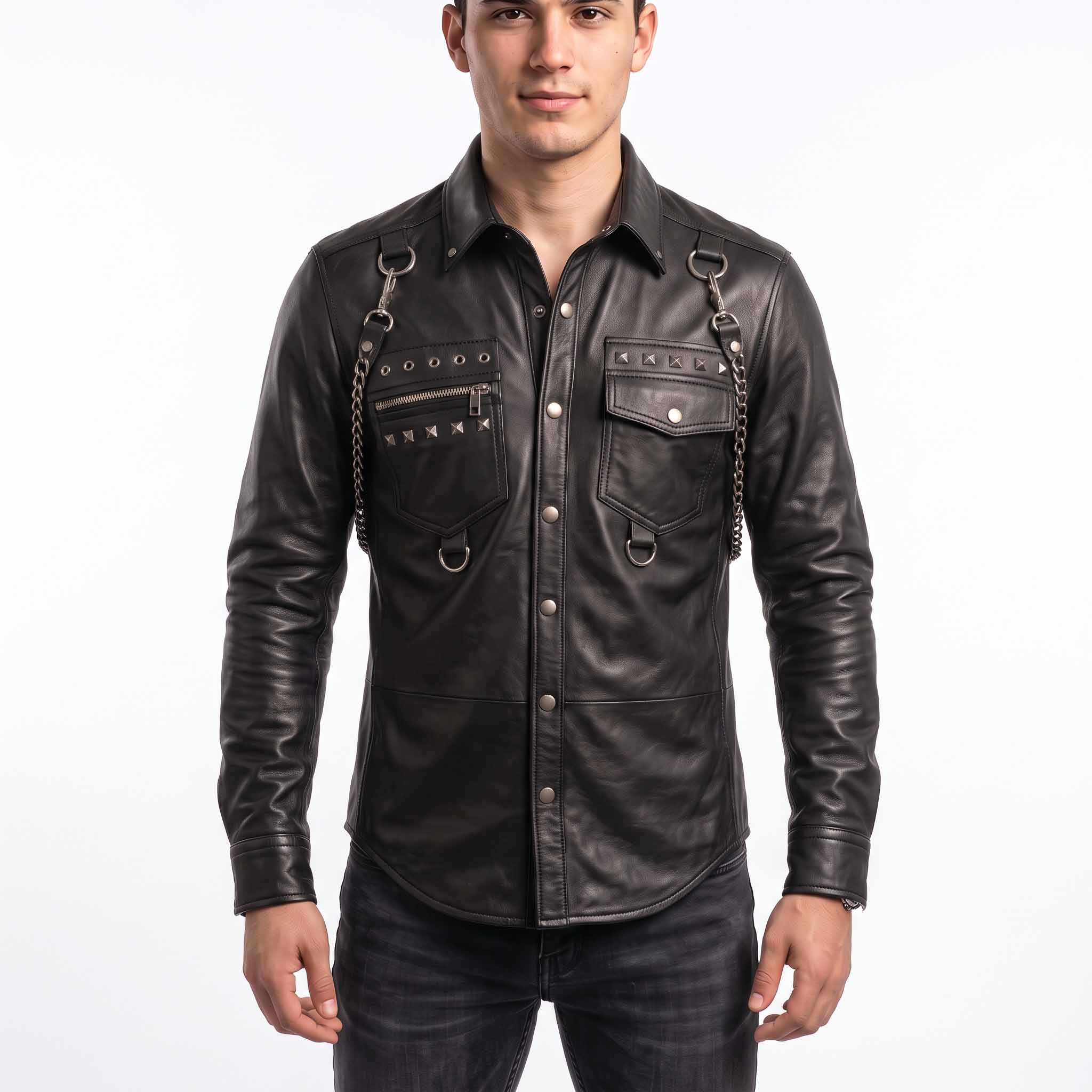 Full front view of handsome young man wearing handmade black sheepskin leather shirt with silver studs, shoulder chains, and snap button placket
