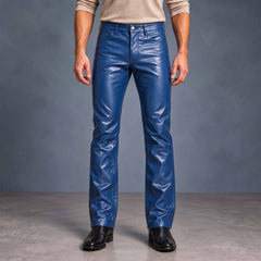 Full-length front view of man wearing tailored royal blue cowhide leather slim bootcut pants with black dress boots