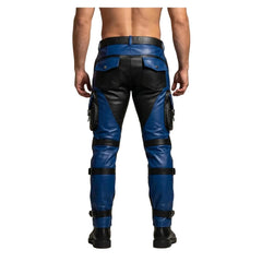 Rear view of a man wearing blue and black leather cargo pants with utility pockets and leg straps, shown against a plain beige studio background. A Leather Manus logo appears in the top-left corner.