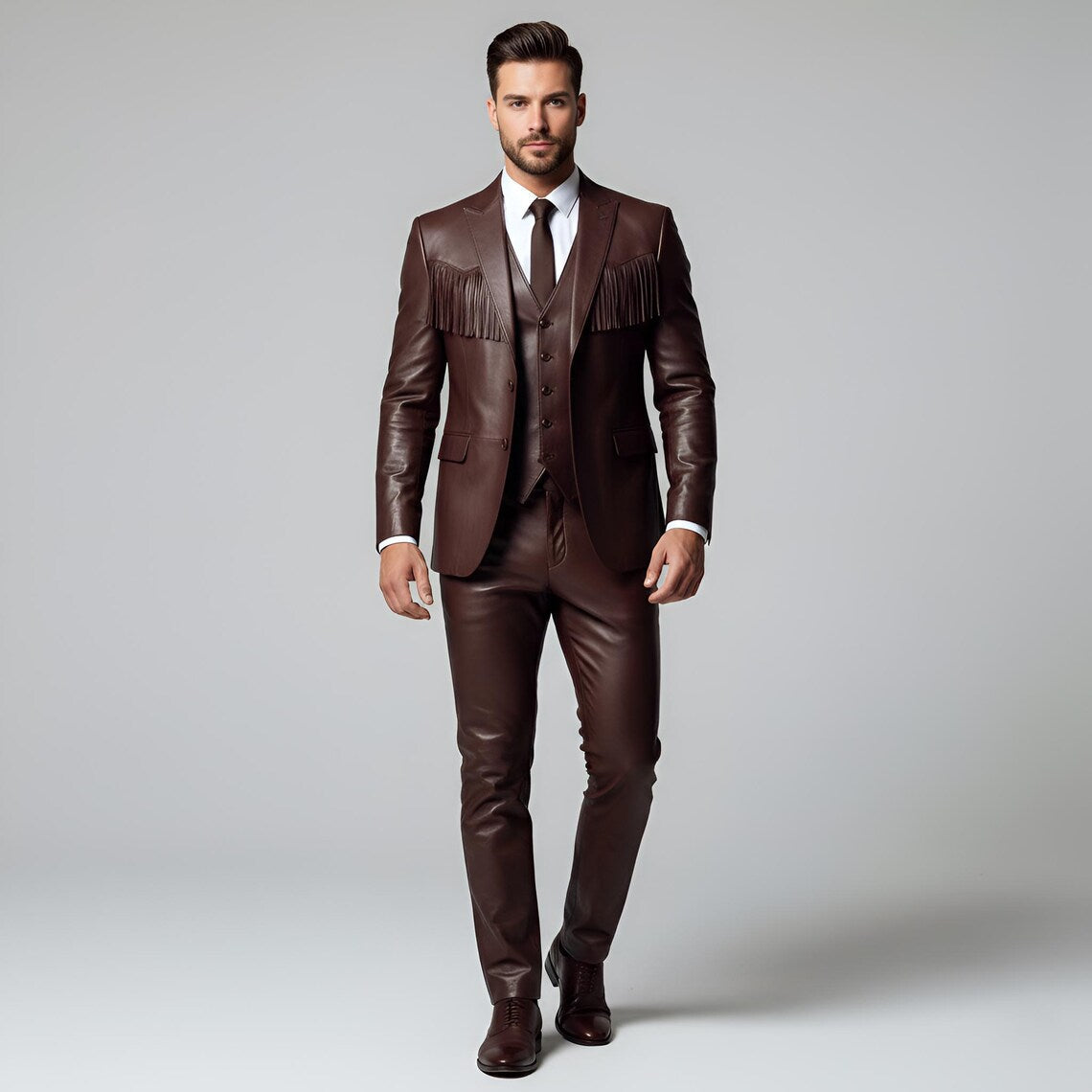 Full-length front view of men's bespoke 3-piece brown genuine leather suit with fringed blazer, matching vest, and tailored pants