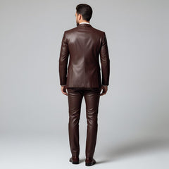Rear view of tailored men's rich brown leather suit showing smooth back panel jacket and slim-fit matching leather trousers