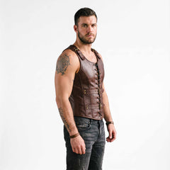 Side profile three quarter view of man wearing tailored brown leather steampunk jerkin showing deep armhole cut and flank lacing