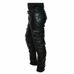 Side profile view of men's black cowhide leather cargo trousers displaying stacked snap-flap pockets and diamond-quilted knee panels.