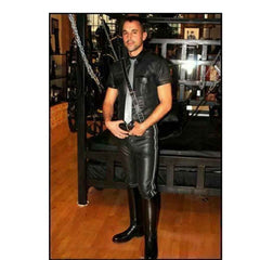 Man wearing a full leather outfit including short-sleeve shirt, tie, and black side-striped leather breeches in a club setting.