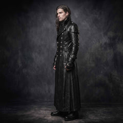 Side profile angle of man wearing full length black leather gothic duster coat detailing high collar shoulder capelet and buckled sleeve cuffs