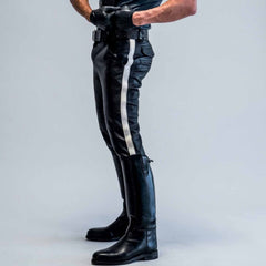 Side profile view highlighting the slim tapered leg, mid-rise fit, and striking vertical white stripe detail of the leather breeches.