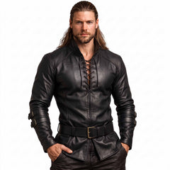Front studio portrait of muscular man wearing handmade black cowhide leather viking shirt with center chest cord ties and leather waist belt