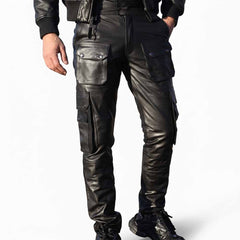 Full-length front view of men's multi-pocket black cowhide leather cargo pants styled with a black leather jacket.