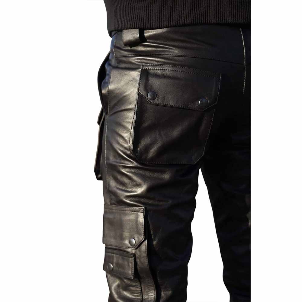 Close-up view of the rear snap flap pocket and side thigh cargo pocket on men's black leather trousers.