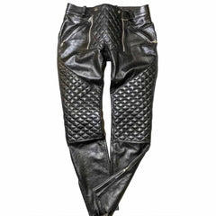 Front view of men's black real cowhide leather pants with quilted knee panels and zipper detailing.