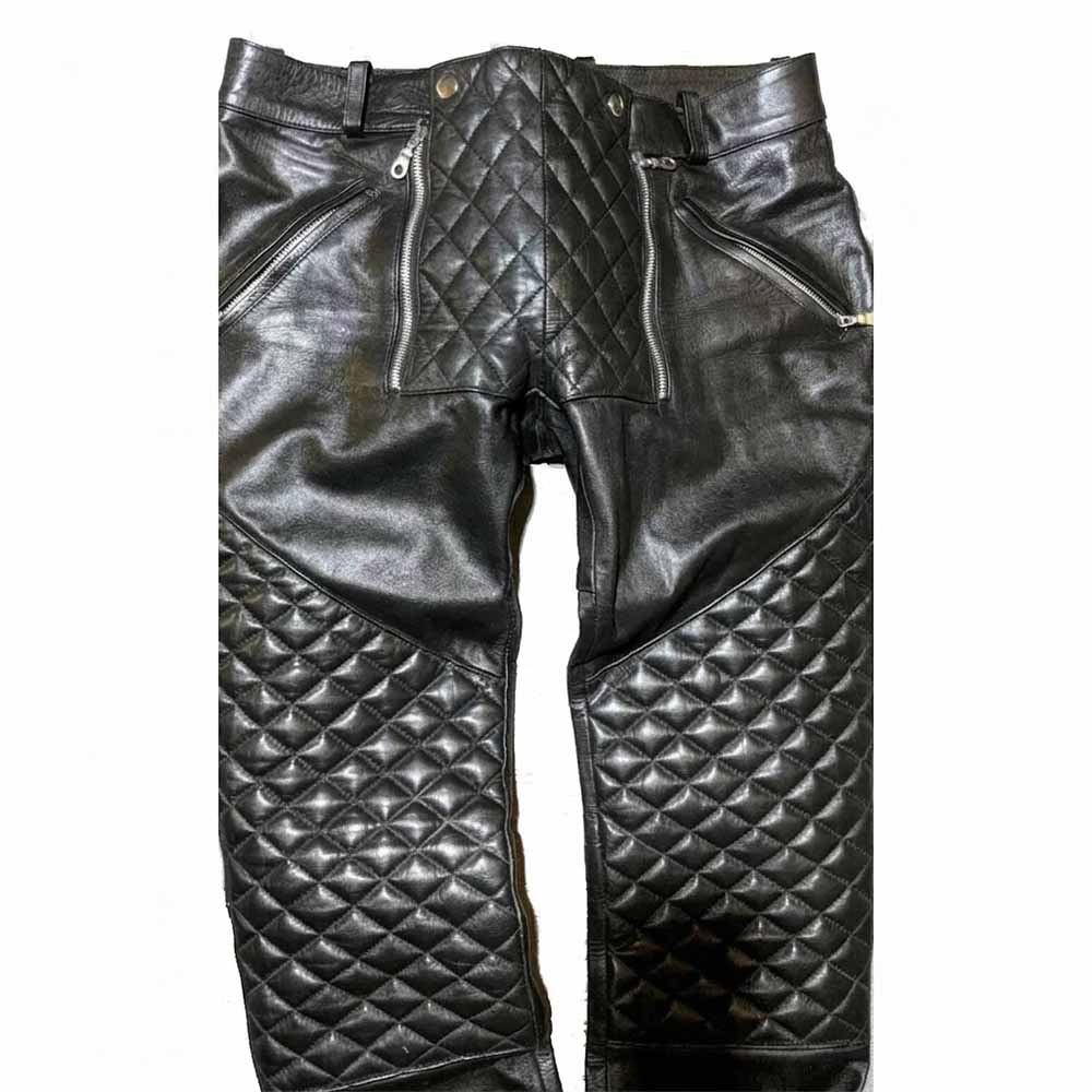 Detailed front view highlighting the quilted waist panel and heavy-duty zip closures.