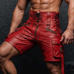 Three quarter close up view of man wearing red leather biker shorts highlighting side eyelet lacing slant zipper pockets and thigh cargo pouch