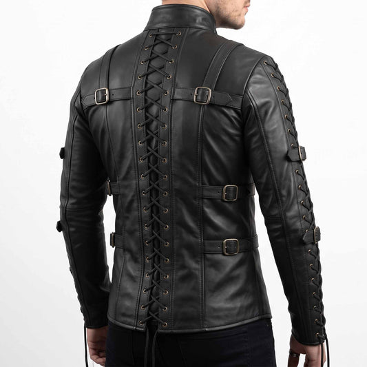 Rear three quarter perspective of man in tactical black leather armor shirt with hands clasped behind back highlighting sleeve and spine lacing