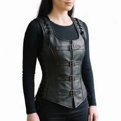 Front three-quarter perspective of woman modeling black leather gothic corset top detailing front buckle straps and side rib eyelet ties