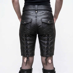Back view of woman wearing tailored black leather bermuda shorts showing rear snap flap pockets and vertical corset lacing on lower thighs