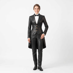 Full length front studio view of smiling woman wearing handmade black sheepskin leather tailcoat suit with gold buttons, bow tie, and tailored trousers