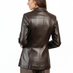 A woman wearing a dark brown leather jacket, shown from the back against a plain white background.